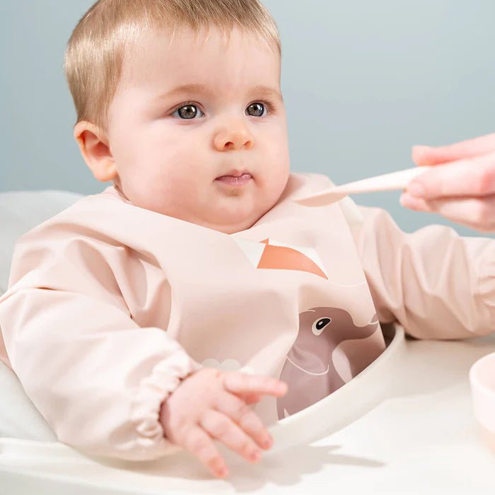 Babero grande con mangas y bolsillo Playground rosa 6-18 meses